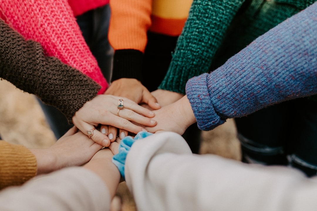 women's hands coming together