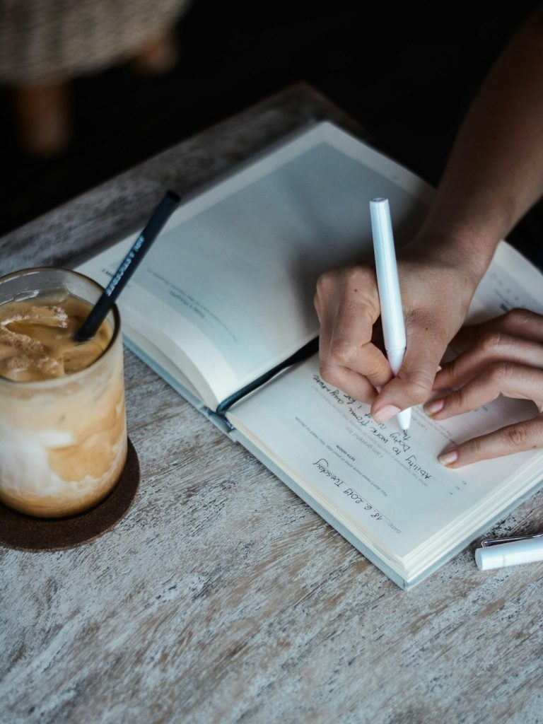 woman writing in a journal