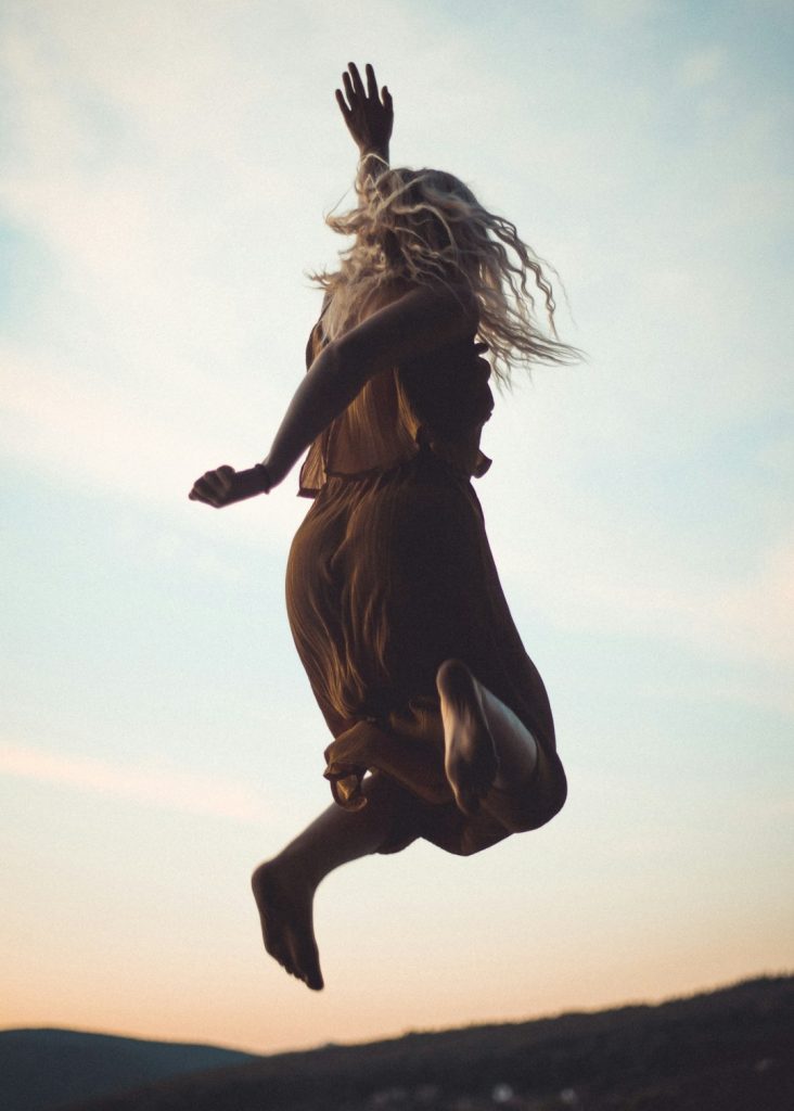 woman jumping in the air