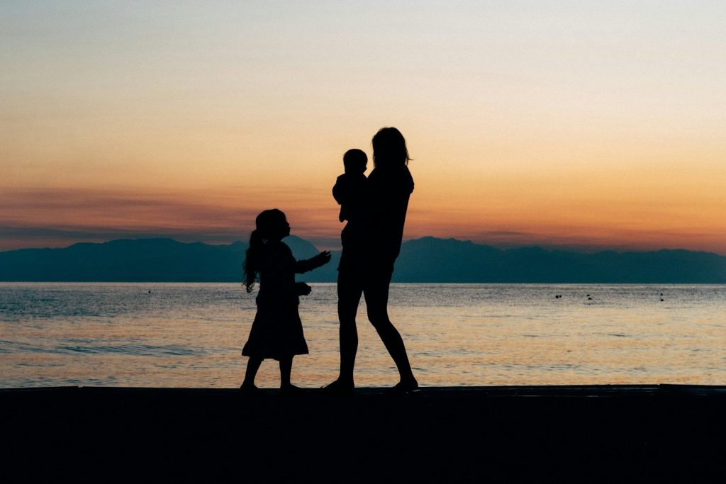 woman and children on beach